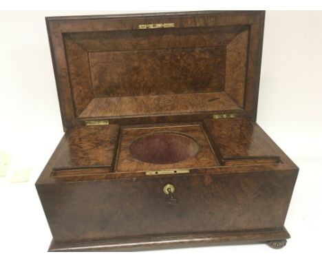 A Quality Early Victorian walnut tea caddy with a well fitted interior and two sections.
