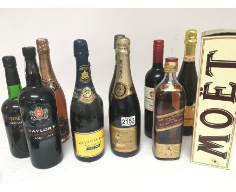 A collection of Ports wines Champagne and a bottle of Johnny Walker old Scotch whisky.