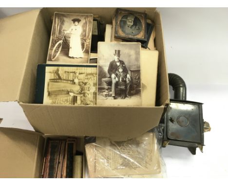 A collection of mixed slides and photographic ephemera together with a child's magic lantern and slides.