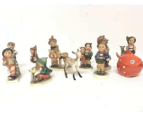 A collection of vintage ceramic Hummel figures and other oddments.