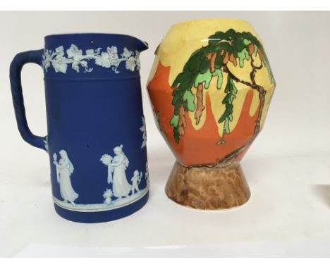 An Art Deco Memory Lane Wilkinson vase and a Wedgwood Jasper ware jug.