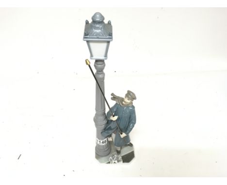 A large Lladro  figure of a man lighting a street gas lamp no damage. Height 48cm