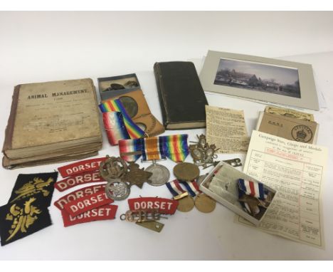 A group of First World War medals awarded to D-8432 Pte Thomas William Chandler sixth Dragon guards the group with some life 