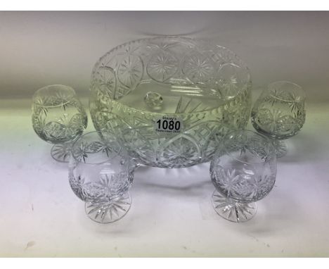 A large cut glass punch/fruit bowl together with 4 Thomas Webb crystal glasses.