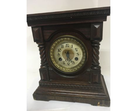 A Continental walnut mantel clock with spiral pilasters NO RESERVE