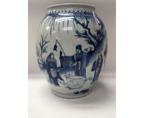 A Chinese Kangxi blue and white Baluster vase decorated with figures amongst a landscape view . Six charter mark to base 25 c