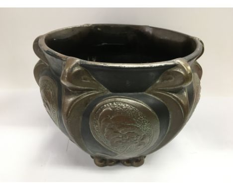 An Art Nouveau Bretby planter with typical stylised decoration, approx height 22.5cm.