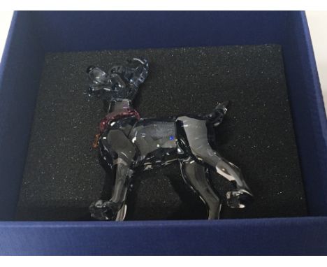 A Swarovski Crystal Disney figure of Tramp,with ruby coloured collar boxed no damage. With Lady Tramp plaque boxed. (2)