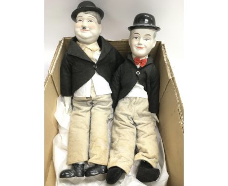 Two bisque headed Laurel &amp; Hardy dolls, approx length 47cm.