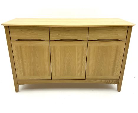 Light oak sideboard, fitted with three long drawers, above three cupboards enclosing fitted shelving pan stile supports Dimen