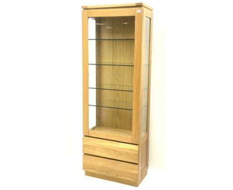 Solid light oak glazed display cabinet, fitted with two base drawersDimensions: Height:&nbsp;183cm&nbsp; Length/Width:&nbsp;6