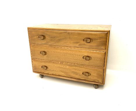 Ercol elm chest, fitted with three long drawers, raised on castors Dimensions: Height:&nbsp;66cm&nbsp; Length/Width:&nbsp;92c