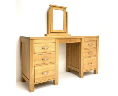 Light oak dressing table with mirror, six graduating drawers, raised on stile supports Dimensions: Length/Width:&nbsp;141cm&n