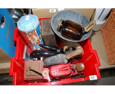 A box of miscellaneous, tins, tractor horn, bookends, etc.