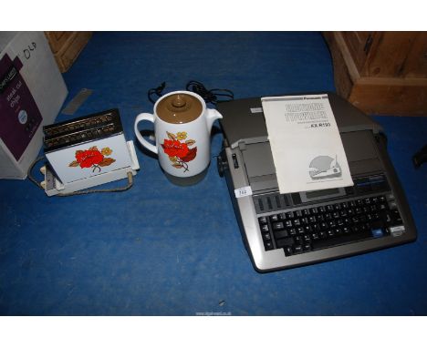 A vintage "Russell Hobbs" toaster and kettle, plus a "Panasonic" electric typewriter.