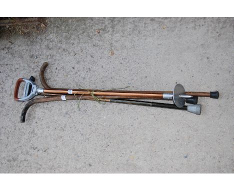 Three walking sticks and a shooting stick.