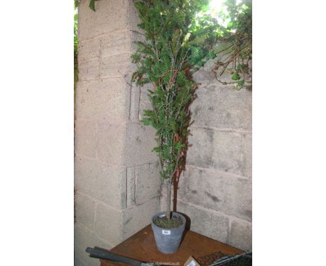 An artificial tree in a pot.