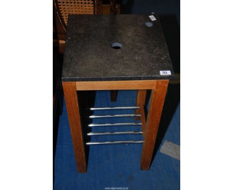 A sink stand with a granite tops, 16" square x 28" high.