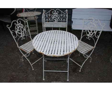 A metal patio table, 27 1/2" diameter x 28" high, with two chairs and a matching folding plant stand.
