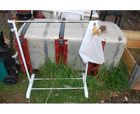 A clothes rail and coat hangers.