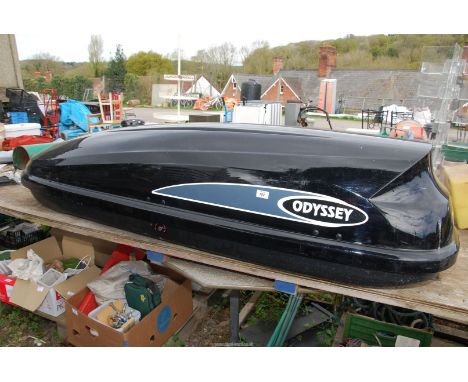 An "Odyssey" car roof box, with attachments approx. (Keys in Pay office), 78" x 21" x 16" high.