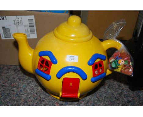 A "Bluebird" big yellow teapot toy with figures.