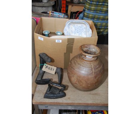 A box of china, cast iron shoe last and iron etc.