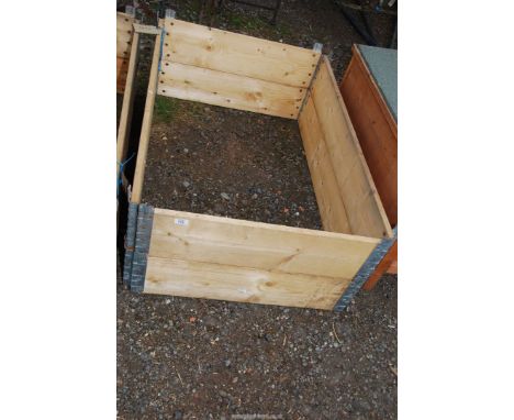 A raised bed frame, 47" x 31" x 15 1/2".