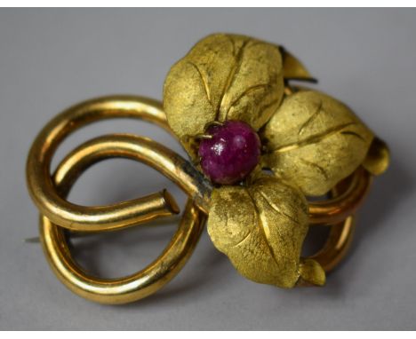 A Victorian Yellow Metal Tube Brooch with Later Yellow Metal Leaf Mount Housing a Large Ruby 