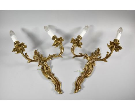 A Pair of Early 20th Century French Gilt Metal Two Branch Wall Light Fittings, 41cm high 