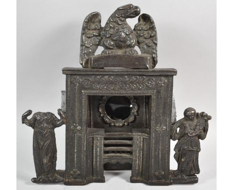 A Late 19th Century Cast Iron Pocket Watch Holder in the Form of a Cooking Range, One Side Figure Missing Head, Eagle Pedimen