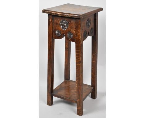 An Edwardian Oak Square Topped Plant Stand with Carved Decoration and Stretcher Shelf, 65cm high 