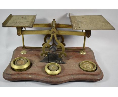 A Set of Early 20th Century Brass Postage Scales on Serpentine Front Wooden Plinth, Some Weights but Unrelated, 30cm wide 