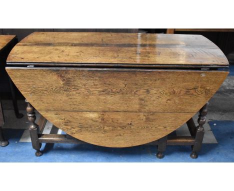 A Late 19th Century Oak Drop Leaf Gate Legged Oval Topped Table, 135cm Long 