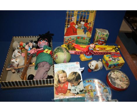 A box of vintage toys including puppet, circus monkey etc.