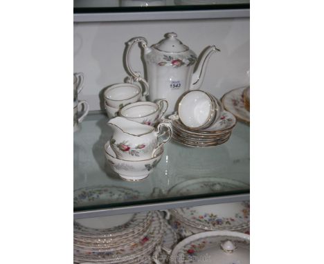 A 1940's Paragon coffee service in 'Bridal Rose' pattern consisting of six cups and saucers, milk jug, sugar basin and coffee