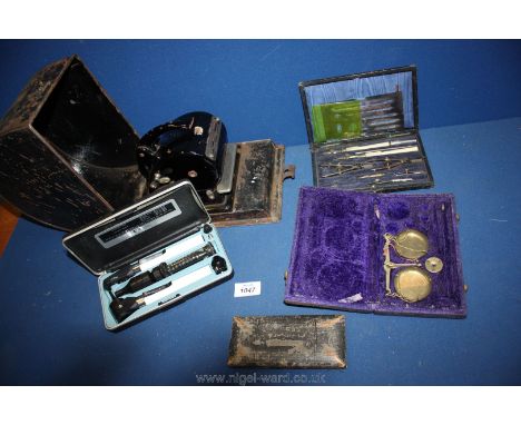 A box of drawing/draughtsman sets in boxes, scales, ophthalmoscope, Protectograph in metal box, etc.
