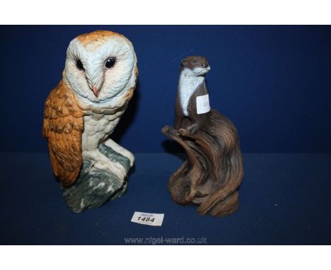 A figure of an Otter on a tree trunk by 'A walk in the Counrty' and a Leonardo figure of an owl.