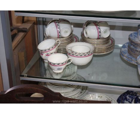 A thirty-seven piece white with black, pink and gold border pattern tea service, Tuscan china, England, circa 1930-1940, incl