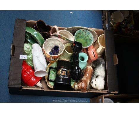 A large quantity of china to include a Wade jug, Gurgle jugs, Coopercraft dogs, Sylvac planter etc.