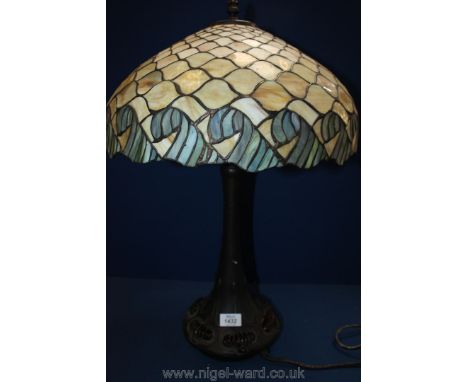 An Art Nouveau based Table lamp with large Tiffany style shade.