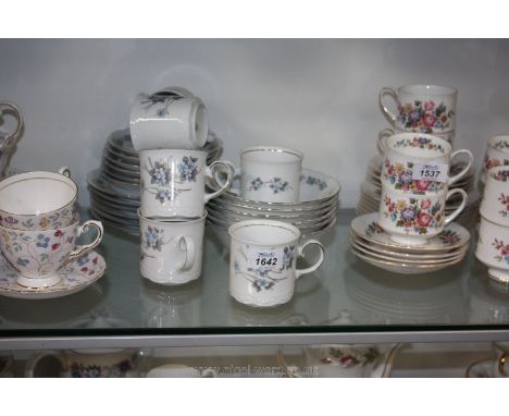 A Bavarian 'Mittertech' tea set including six cups, six saucers, five bowls, six side plates, all with a blue flower design w