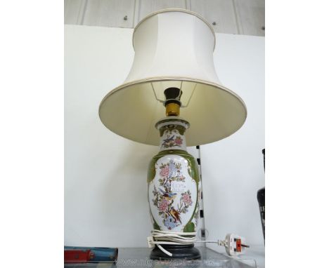 A Marks &amp; Spencer oriental style floral lamp having a cream shade.