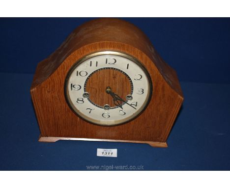 A chiming wooden cased Mantle Clock.