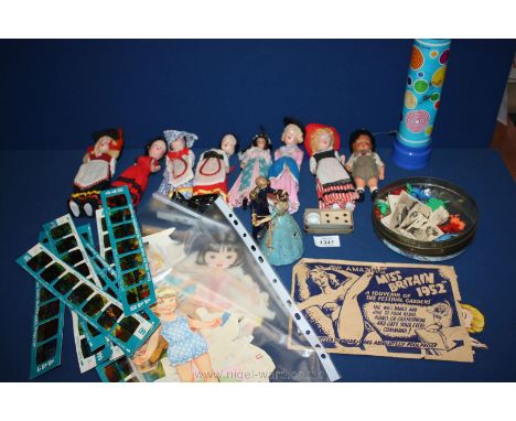 A quantity of vintage toys including kaleidoscope, cut out dress-up dolls, tin plate clockwork dancing couple, novelty 'Every