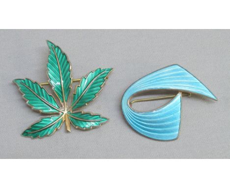 A SILVER GILT AND GREEN ENAMEL MAPLE LEAF PIN BROOCH BY BERNARD MELDAHL STAMPED 925 S STERLING, MADE IN NORWAY (8.1g) AND A S