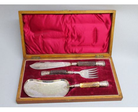 A VICTORIAN STERLING SILVER AND SILVER PLATED FISH SERVING KNIFE, FORK AND CRUMB SCOOP SET WITH ANTLER HANDLES, HALLMARKED SI