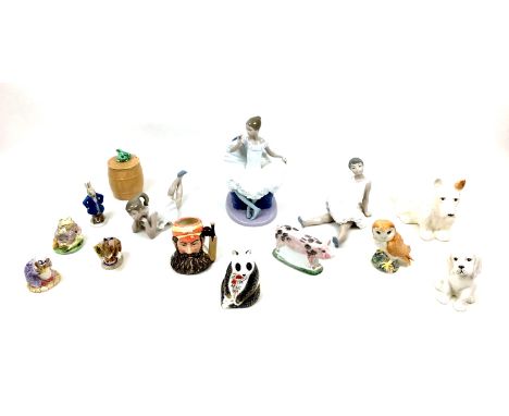 A group of fourteen ceramics and figurines, comprising a Royal Crown Derby Panda paperweight with silver stopper, three Beatr