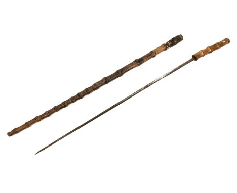 A Victorian bamboo sword stick, no visible maker's name but some foliate decoration to one side of the blade, blade length 65