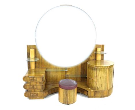 An African ofram wood Art Deco style dressing table, with large circular mirror and an arrangement of low level drawers and g